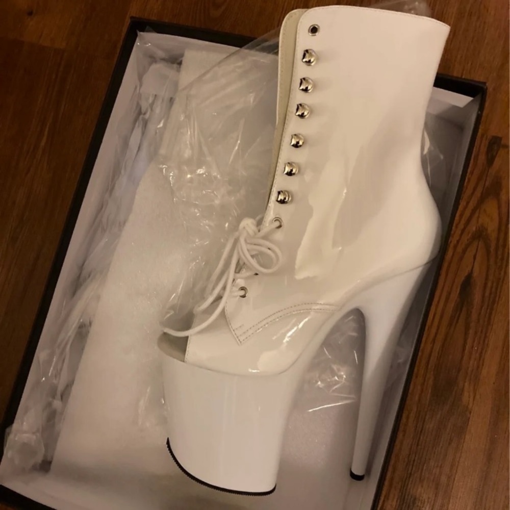 Two pairs of Pleaser 8” tall boots, size 7